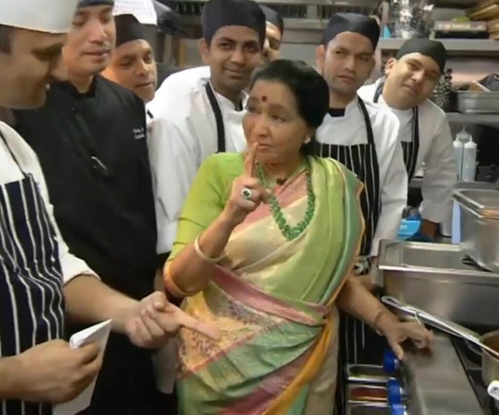 sha-Bhosle-with-Chefs-in-her-restaurant-kitchen