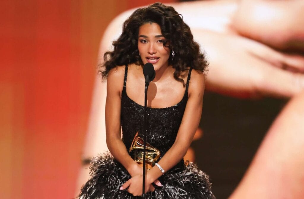 Olivia Dean performing live on stage