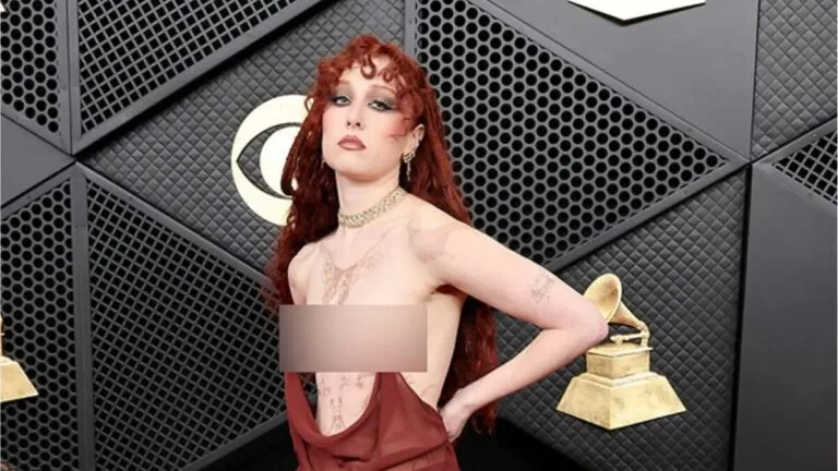 Chappell Roan wearing a sheer maroon Mugler "nipple ring" gown at the 2026 Grammy Awards.
